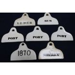 Seven 19th century creamware pyriform bin labels, arched suspension holes unmarked