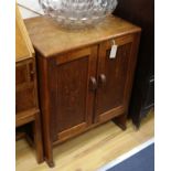 A small Heal's oak two door cabinet (Ivorine label) W.61cm