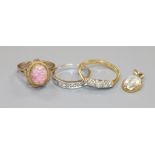 Two 18ct gold and diamond rings, a 9ct gold ring and a moonstone pendant.