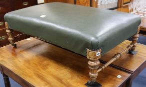 A Victorian green leather upholstered stool W.106cm