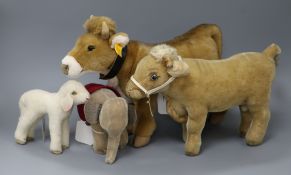 A Steiff cow with bell, 'Bertha', no. 072963, button in ear and three other Steiff toys, including a