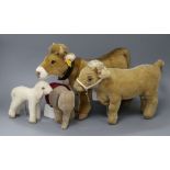 A Steiff cow with bell, 'Bertha', no. 072963, button in ear and three other Steiff toys, including a