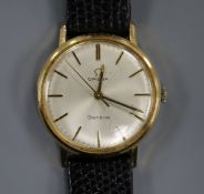 A gentleman's gold plated and steel Omega manual wind mid-size wrist watch.