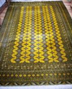A mustard ground carpet 330 x 220cm