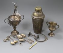 Two silver trophy cups, five silver teaspoons, a silver frame mount, a silver Celtic style brooch