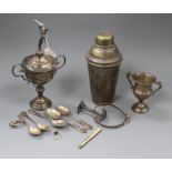 Two silver trophy cups, five silver teaspoons, a silver frame mount, a silver Celtic style brooch