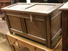 An 18th century panelled oak coffer W.93cm