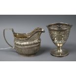 A George III demi fluted silver cream jug, London, 1809? and a George III pierced silver sugar