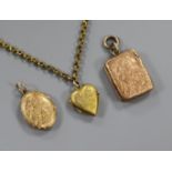 Three engraved 9ct gold lockets and a gilt metal chain.