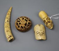 Four Japanese staghorn netsuke, 19th century including two masks, a bamboo shoot and a pomegranate