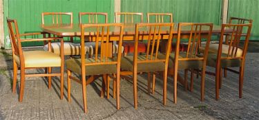 Gordon Russell, extending teak dining table with ten chairs including two carvers W.230cm