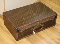 A Louis Vuitton suitcase, serial no. 809790, the lock stamped 076093, initialled JNP