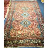 A Persian russet ground rug 270 x 164cm