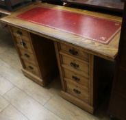 An Edwardian oak pedestal desk W.125cm