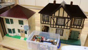A 1930's Tri-Ang dolls' house. No. 61 and another unnamed smaller dolls' house, each with