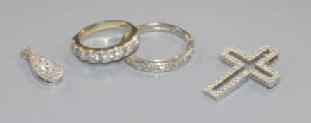 Two 18ct gold and diamond half eternity rings and two diamond set pendants including 9ct white