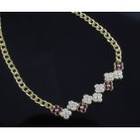 A Garrard & Co 18ct yellow gold curb-link necklace, with seven diamond and four ruby conjoined