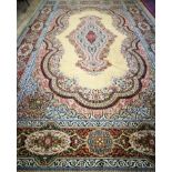 A large Wilton Persian design cream ground carpet 490 x 300cm