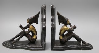 After Lorenzl. A pair of bronzed metal marble bookends height 20cm