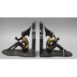 After Lorenzl. A pair of bronzed metal marble bookends height 20cm