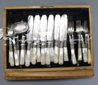 A set of twelve pairs of mother of pearl-handled plated fish eaters (canteen a.f.) and a silver