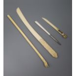 An Indian ivory backscratcher and three paperknives