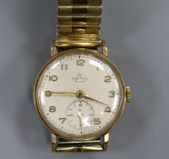 A gentleman's 9ct gold Smiths De Luxe manual wind wrist watch.