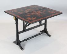 An unusual Victorian ebonised Sutherland table, with raised red lacquered chinoiserie floral and