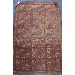 An Afghan red ground geometric patterned rug 145 x 102cm