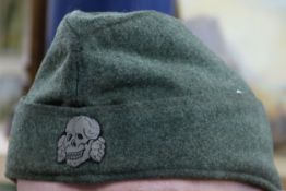 An SS Forage cap, dated
