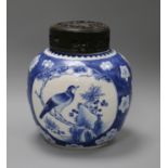 A Chinese blue and white prunus jar, wood cover, 19th century overall height 24cm