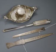 A George III silver marrow scoop, two silver letter openers and a silver ink stand, the marrow scoop