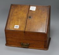 An Edwardian oak stationery box