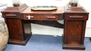 A William IV mahogany pedestal bowfront sideboard, with frieze drawer, the pedestals each with a
