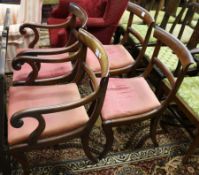 A set of four Regency mahogany dining chairs (two arm, two single)