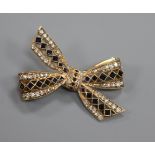 A modern 9ct gold, sapphire and diamond set ribbon bow brooch, 39mm.