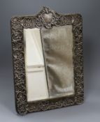 An Edwardian repousse silver mounted easel mirror by Walker & Hall, Sheffield, 1902, overall 40.