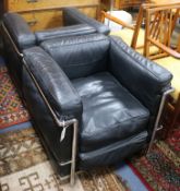 A pair of Le Corbusier style black leather and chrome chairs