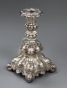 An ornate continental white metal candlestick, loaded, 18.3cm.