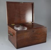 A large Regency mahogany tea caddy, of plain rectangular form, the lid opening to reveal two cut