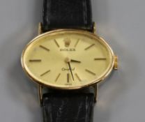A lady's 18ct gold Rolex Orchid manual wind wrist watch, with oval dial.