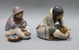 Two Lladro figures: An Eskimo 'Girl with Cold Feet' and Eskimo 'Fish Seller'