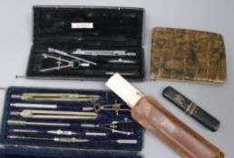 A silver and mother of pearl fruit knife, crocodile wallet and drawing instruments
