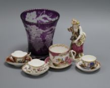 Four Dresden miniature cups and saucers, a wheel engraved vase and a porcelain figure of a lady