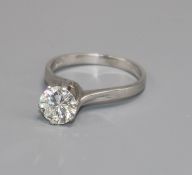 An 18ct white gold and solitaire diamond ring, 1.30cts, with original receipt