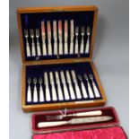 A cased set of twelve pairs of late Victorian silver dessert eaters and a cased knife and fork.