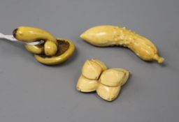 Three Japanese ivory netsuke, 19th century carved as mushrooms inlaid with a beetle, nuts and a