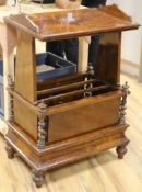 An unusual Victorian walnut Canterbury with shelf above and a concealed drawer to the base W.61cm