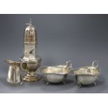A silver octagonal baluster sugar caster, a pair of sauce boats with gadrooned edges and a cream