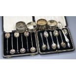 Two sets of six George V silver coffee spoons, three silver napkin rings, a Chinese napkin ring